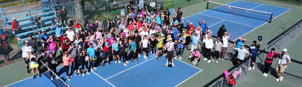 pickleball volunteers waving